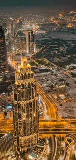 Aerial view of city skyscrapers at night with illuminated roads.