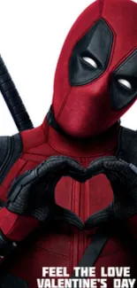 Deadpool makes a heart gesture for Valentine's Day against a red backdrop.