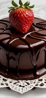 Decadent chocolate cake with strawberry topping on a plate.