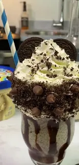 Oreo milkshake with whipped cream and chocolate toppings.