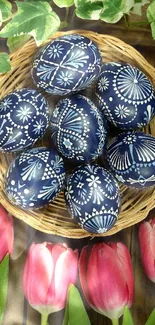 Basket of intricately patterned Easter eggs with tulips and leaves.