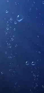 Mobile wallpaper with deep blue bubbles giving a serene and calming effect.