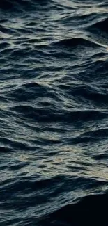 Serene mobile wallpaper of deep blue ocean waves.