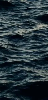 Deep blue ocean waves with textured dark surface