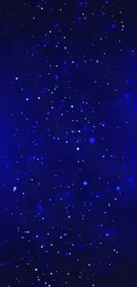 Deep blue starry night wallpaper with glowing celestial specks.