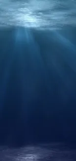 Mobile wallpaper with deep ocean light rays and blue hues.