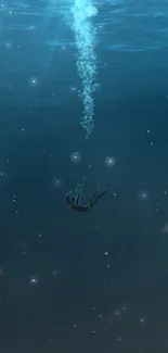 Diver in deep blue ocean underwater wallpaper