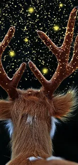 A deer with antlers surrounded by glowing lights on a dark background.