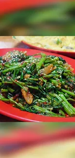 Colorful Asian stir-fry on red plate with fresh greens.