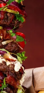 Delicious burger stack against a brown background, featuring fresh ingredients.