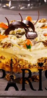 Carrot cake topped with chocolate decorations on a rustic table.