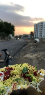 Colorful street food chaat in evening urban scene with a soft sunset.