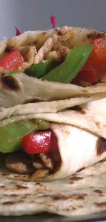 Close-up of a delicious chicken wrap with vibrant peppers.