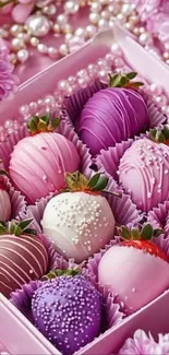 A decorative box of pink and purple chocolate-covered strawberries.