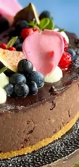 Chocolate cheesecake with mixed berry toppings and a hint of edible flowers.