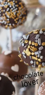 Chocolate cake pops with sprinkles and heart decor.