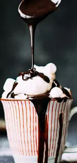 Chocolate dripping over dessert in cup.