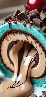 Chocolate dessert art with blue swirl and cherry top.