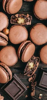 Chocolate macarons and squares on dark background.