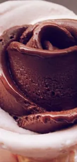 Chocolate ice cream rose on a cone.
