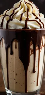 A decadent chocolate sundae with whipped cream and chocolate drizzle.