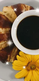 Coffee with croissant and a yellow flower on a plate.