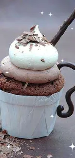 Chocolate cupcake with creamy frosting and chocolate stick topping.