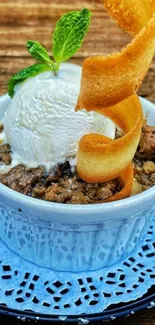 Delicious dessert with ice cream and mint garnish in a blue bowl.