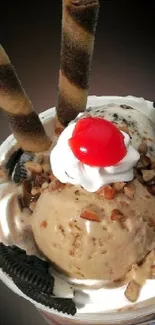 Ice cream sundae with cherry and chocolates on a dark background wallpaper.