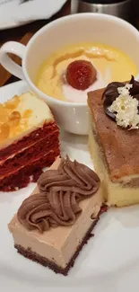 Assorted desserts on a plate with a custard cup and cakes.