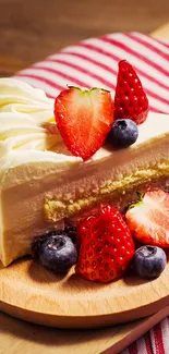 Slice of cake with strawberries and blueberries on a wooden board.