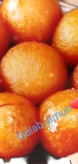 Golden brown Gulab Jamun with a heart emoji and smiley.