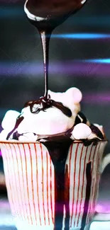Hot chocolate with marshmallows and a chocolate drizzle in a striped mug.