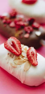 Ice cream bars with strawberries and almonds on pink background.