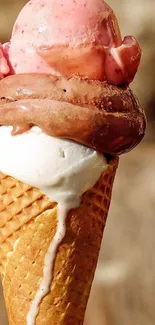 Three-scoop ice cream cone with strawberry, chocolate, and vanilla flavors.