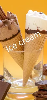 Two ice cream cones in a glass with chocolate squares on an orange backdrop.