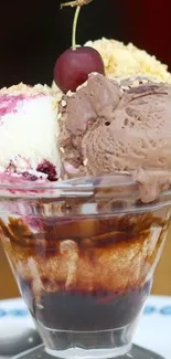 Tempting ice cream sundae with cherry topping and chocolate scoop.