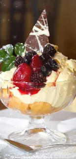 Gourmet ice cream dessert with berries in a glass bowl.