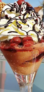Two waffle-bowl ice cream sundaes with toppings outdoors.