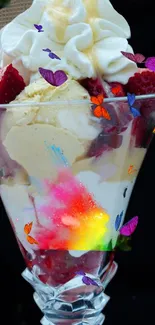 Ice cream sundae with strawberries and whipped cream.