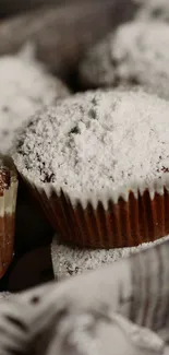 Basket of sugar-dusted muffins, perfect for dessert lovers.
