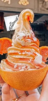 Orange-flavored ice cream in a half orange cup