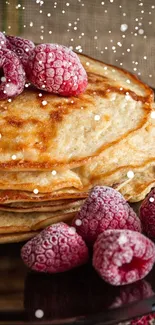 Pancakes with raspberries and syrup on a dark plate, rustic background.