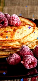 Pancakes with syrup and raspberries on plate.