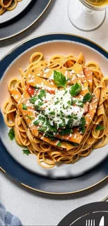 A plate of pasta with garnish.