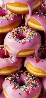 Stack of pink glazed donuts with colorful sprinkles.