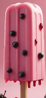 Pink ice cream popsicle with berries on a stick.