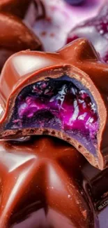 Close-up of star-shaped chocolates with berry filling.