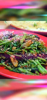 Stir-fried vegetables on a red plate, vibrant and colorful.