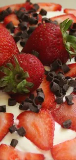 A vibrant strawberry cake with chocolate shavings.